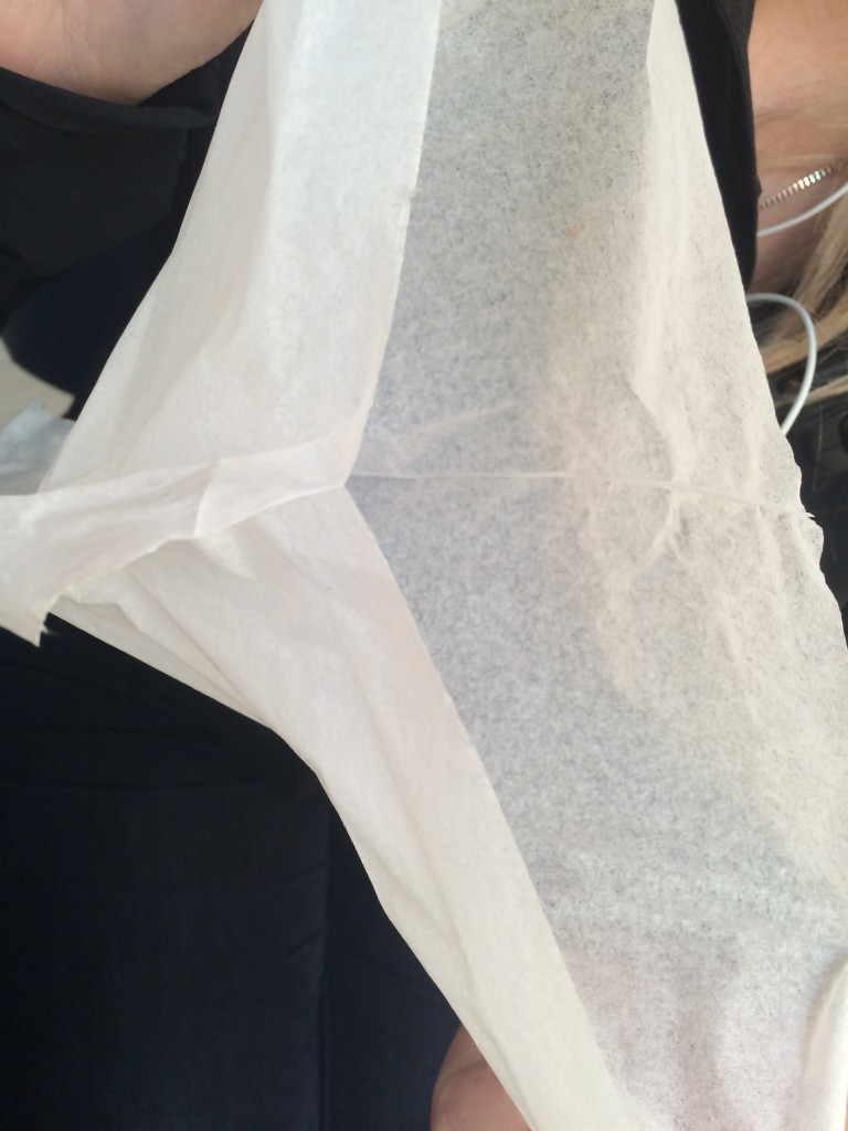 Separate the kleenex into two sheets 